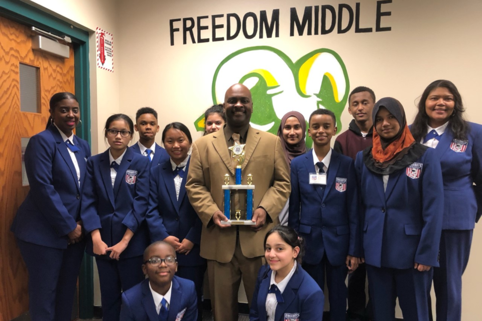 Image of Freebots Team from Freedom Middle School with Their Principal